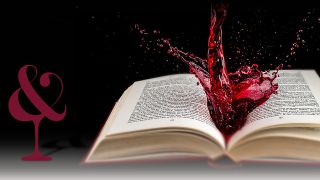 Offenes Buch mit spritzender roter Flüssigkeit auf den Seiten vor schwarzem Hintergrund - DART